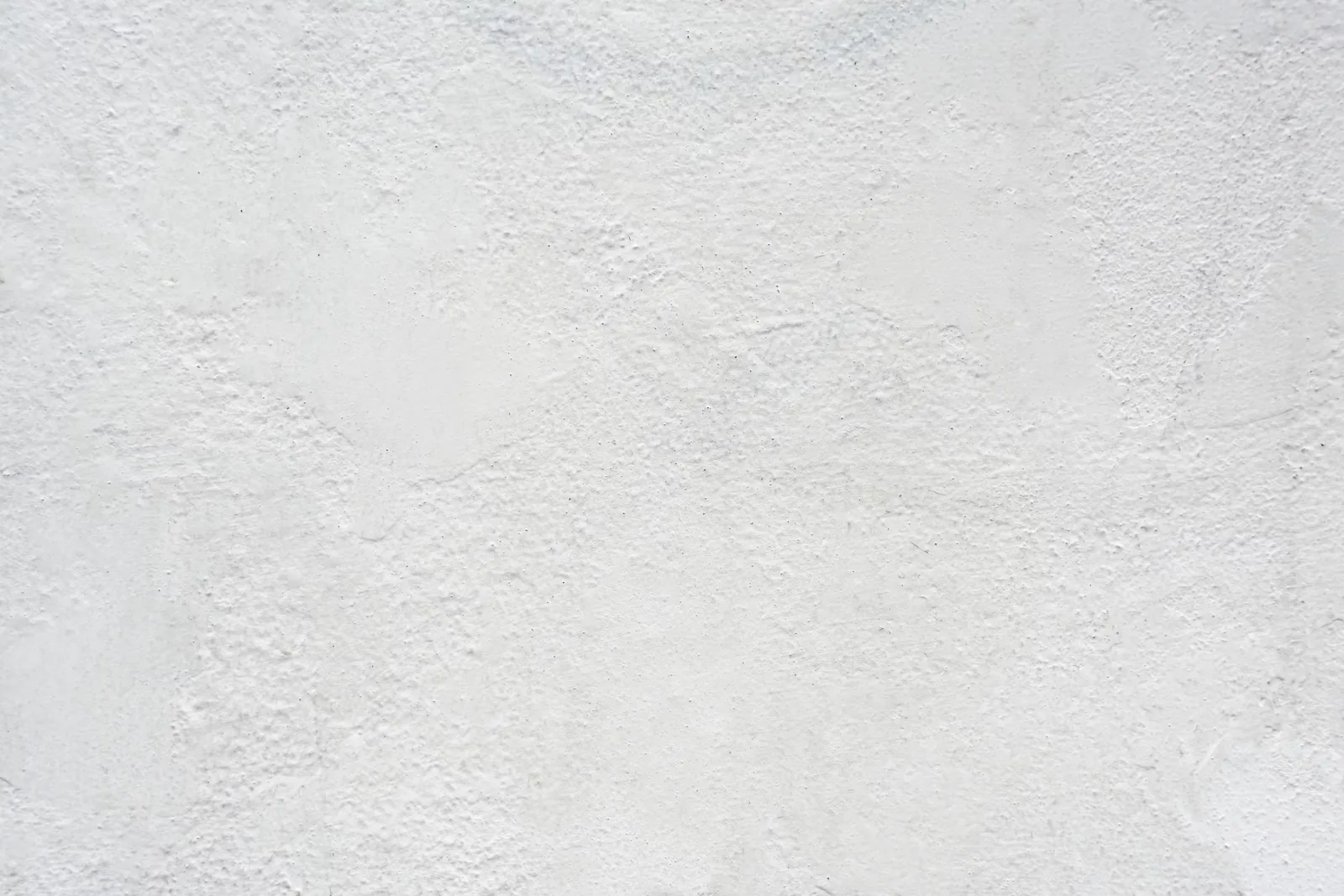 Close-up of a smooth white stucco finish